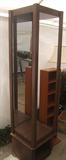 Display unit has mirrored back and adjustable glass shelves