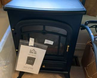 #83	Portable Homeco Electric Fireplace  NC180M	 $40.00 
