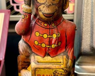 Antique wind-up lithographed tin bank...