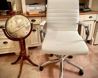 Contemporary office desk chair and world globe on stand