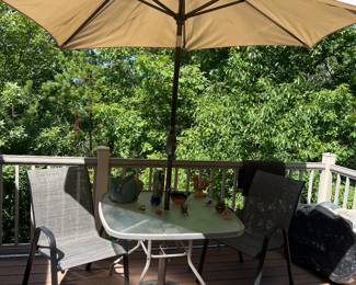 Patio table with 2 chairs and umbrella 
Only the table remains 