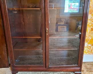 Vintage mahogany glass front bookcases 