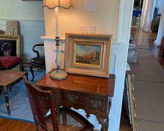 Caned chair, painted lamp, oil painting, antique table