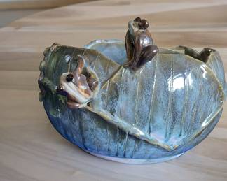 Glazed pot with frogs