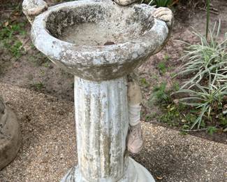 Concrete Boy Hanging on Fountain