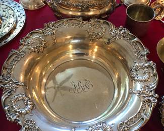 An ornate sterling serving bowl.