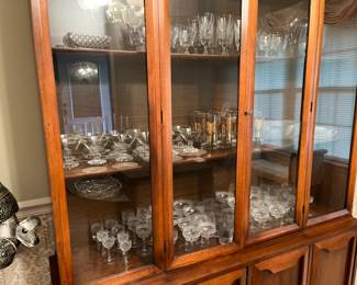 Vintage crystal set. Vintage gold-leaf glass set. Antique crystal stemware from Edwardian era Great Britain circa early 1900’s fills bottom shelf.