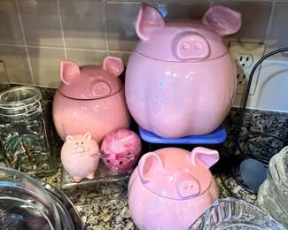 Super cute piggy canisters and a piggy paperweight to boot! 