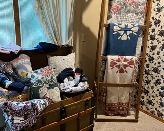 Quilt rack and trunk. 