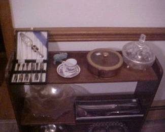 Shelf Unit with Silverplate, Depression Glass, Cut Glass, and a  Jadite Elephant figurine