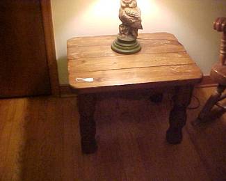 A heavy solid wood end table.