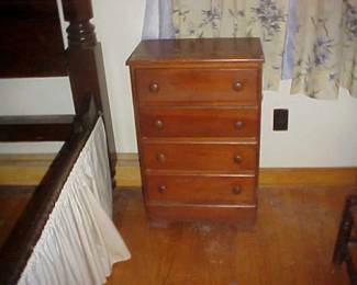 A small chest of drawers.