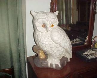 A gigantic owl who has eyes that light up