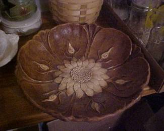 An ornately carved wooden bowl.