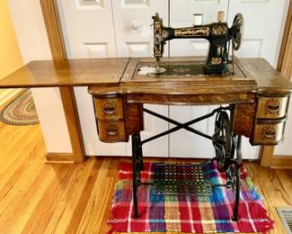Antique White treadle sewing machine in excellent condition