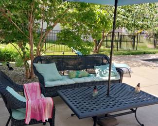 Wicker sofa and chair and table