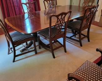 Henredon two pedestal banquet table, (two additional leaves) a pair of armchairs and 8 side chairs.