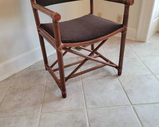 4 McGuire Rattan arm chairs.