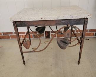 Custom bench made Table by a Georgia ironmonger. ( Ton Hatchett) Wrought & Hand riveted frame on an end tampering leg. Custom cut stone slab. 19.5" × 27.5" × 22.5"