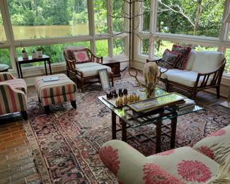 McGuire Rattan love seat,  chair and ottoman,  and glass top coffee table.