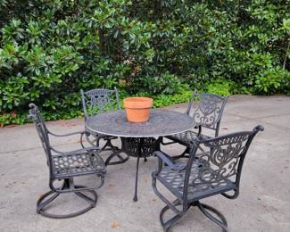 Out door all cast aluminum patio furniture. Each arm chair is a swivel/rocker.