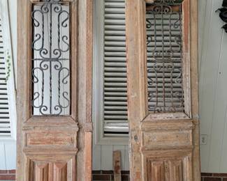 Pair of grand scale chateau doors, with cast iron inset grills. Pine, Poplar and Sycamore woods. 8'×26". 