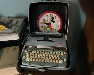 Vintage typewriter and mickey clock