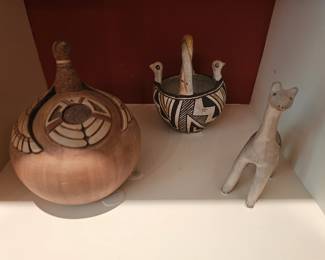 20. Duck effigy jar. Thomas Polacca Nampeyo. Hopi Pueblo, Hopituh Shi-nu-mu. 6"h x 5-1/8" diameter. 1983.
21. Historic Acoma Pueblo Double Headed Bird Pottery Bowl.
22. Cochitti Pueblo Giraffe figure w/rain cloud. C. 1950