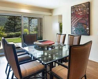70. McGuire Furniture Dining table and 8 chairs