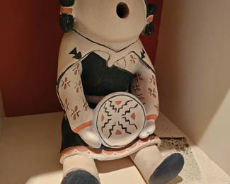28. Mary Trujillo Conchiti Pueblo seated storyteller female pottery figure holding a dish. Clay pigment. 11-1/2" tall.