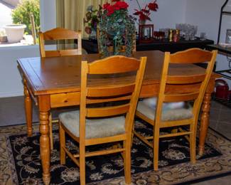 Wooden dining table and chairs (x4)