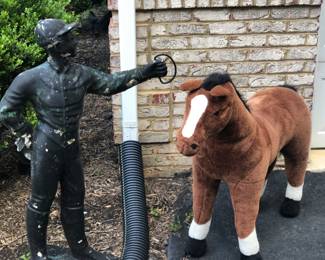Lawn jockey and plush horse 