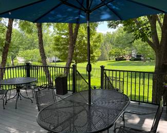 Black rod iron table and 4 chairs
Umbrella and stand