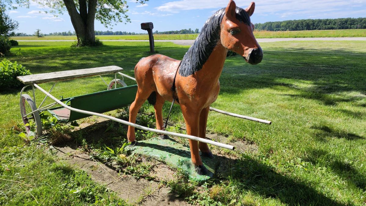 Adorable horse statue with authentic vintage racing sulky