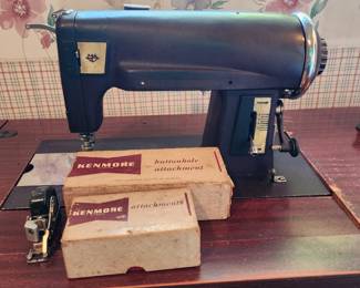 Vintage Kenmore sewing machine with attachments 