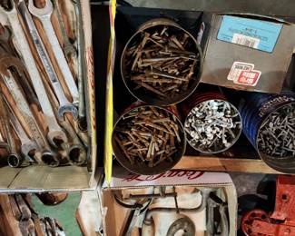 Lots of loose tools and cans with bolts, nails, etc