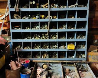 Large metal storage shelf-cubby with odd assortment ofitems