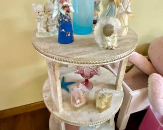 Additional accent table with angel figurines