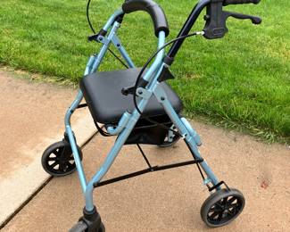 Walker with hand brakes and seat