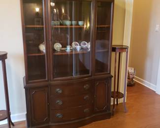 We have 2 matching beveled glass lighted hutch/showcases