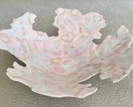 Abstract decorative blue and pink swirl bowl, about 18 inches across. 