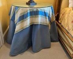 Just one of those little pedestal and glass side tables - linens included.