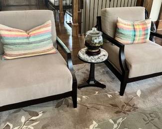Medellin custom armchairs. Dark wood with low multi railed back and custom cushions and upholstery. Sold separately or as a pair. Cushions included. 