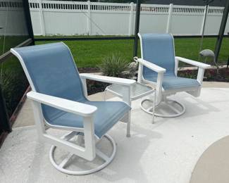 Two Swivel Tilt chairs and 1 side table
