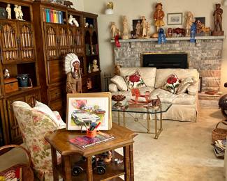 Down filled sofas, hand carved wood figures, wall unit bookcase