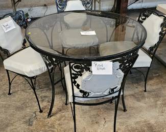GLASS TOP WROUGHT IRON TABLE AND CHAIRS