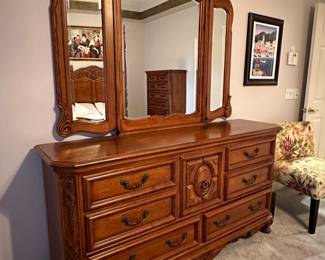 Ashley Furniture Signature Series Oak Dresser, 68" w x 18.5" d x 35.5" h (49.5" h w/ mirror), $245.  Master Bedroom Suite 5-Piece Set, $800.  Mattress sold separately.