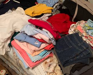 Lots of clothes, jeans and jackets