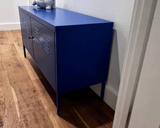 $85 USD     IKEA PS Blue Locker Metal Cabinet Table/Bench JB240-15    A lightweight, durable cabinet in blue metal that fits almost anywhere – in the living room or a home office. Tall legs make cleaning easier, and behind the lockable doors you can store what you hold dear.
Dimensions: 46.5 x 16 x 25"H 
Condition: Used in very good condition commensurate with age and use. 
Local pick up Lake Oswego, OR 97035.  Shipping suggestions available upon request.      https://goodbyhello.com/products/set-of-2-blue-white-swivel-chairs-240-14-copy?_pos=5&_sid=9845e4c55&_ss=r