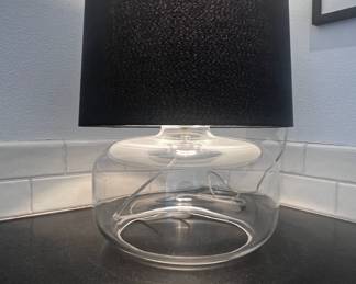 $130 USD     CB 2 Glass Accent Table Lamp w Black Shade JB240-8    Featuring a beautiful smoke glass base and a sleek black shade, this lamp adds a touch of sophistication to any room. Perfect for creating a cozy reading nook or adding ambiance to your living space.
Dimensions: 18 x 13"H  with Shade
Condition: Used in very good condition commensurate with age and use. 
Local pick up Lake Oswego, OR 97035.  Shipping suggestions available upon request.       https://goodbyhello.com/products/set-of-2-glass-table-lamps-240-07-copy?_pos=19&_sid=9845e4c55&_ss=r